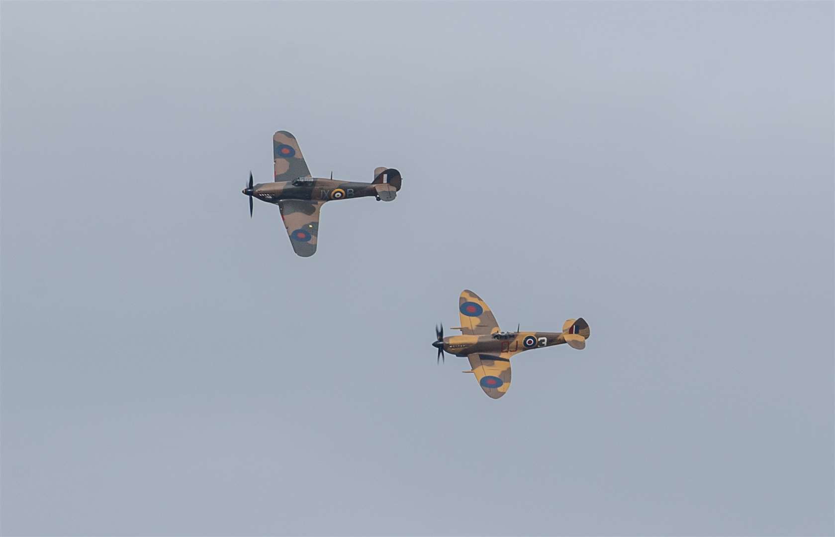 A Battle of Britain Memorial Flight flypast of a Spitfire and a Hurricane passes over the home of Second World War veteran Captain Tom Moore as he celebrates his 100th birthday (Joe Giddens/PA)