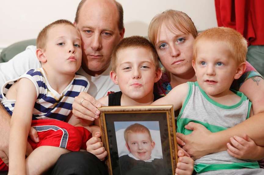 Carrie and Mark Guest with children Alfie, 8, Benjamin, 7, and three-year-old George