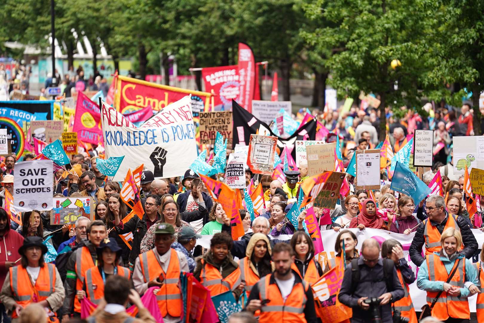 Members of the National Education Union taking part in a rally through Westminster in July 2023 (James Manning/PA)