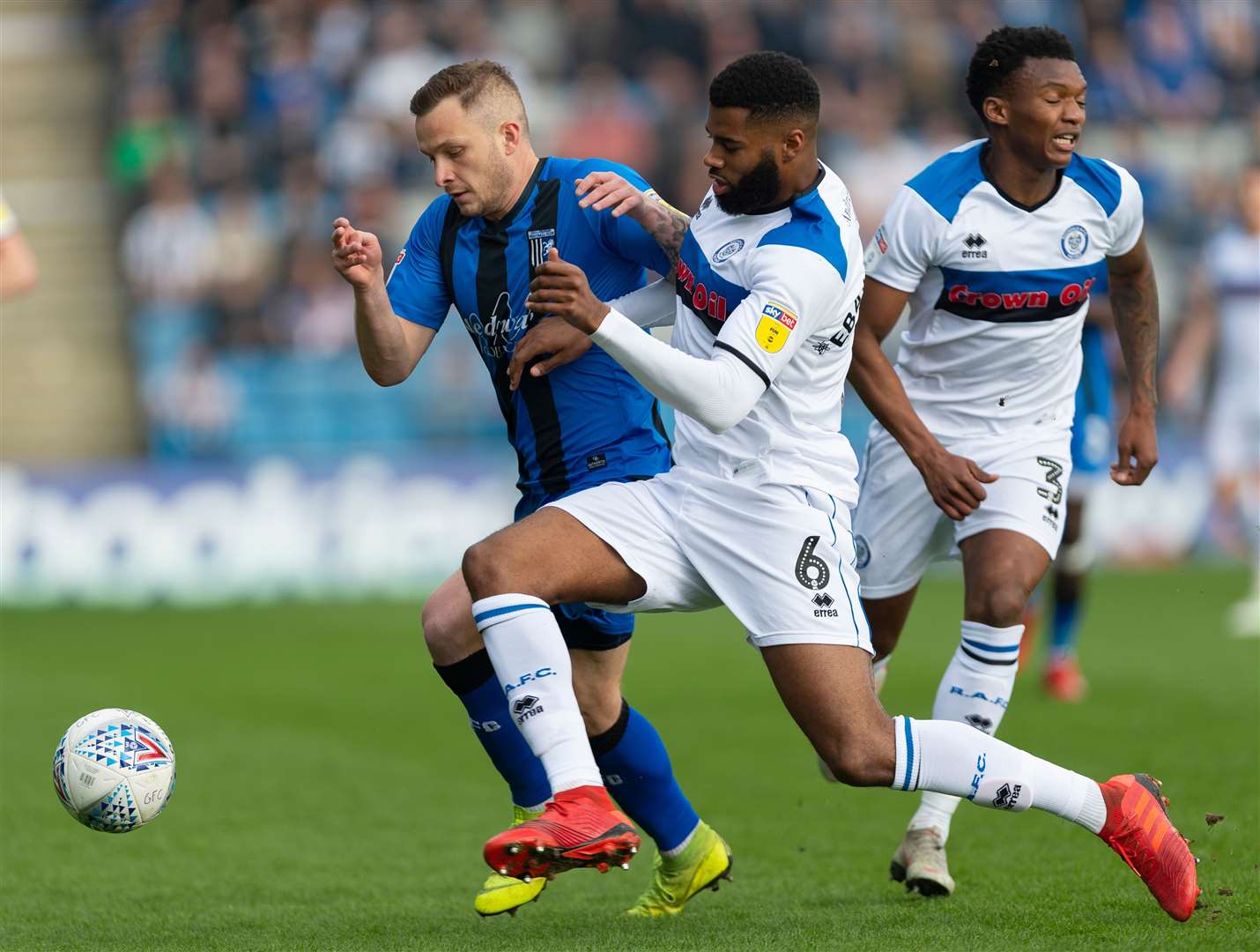 Gillingham vs Rochdale, 30th March 2019.Dean Parrett is challenged by Ebanks-Landell. (8440004)