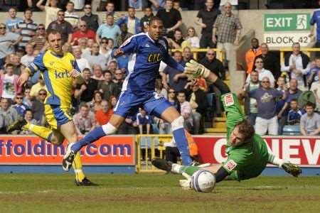 Alan Julian is unable to reach the ball as Shanu Batt puts Millwall in front