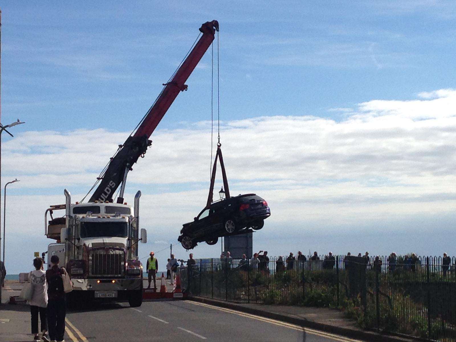 The car was hoisted out by a crane