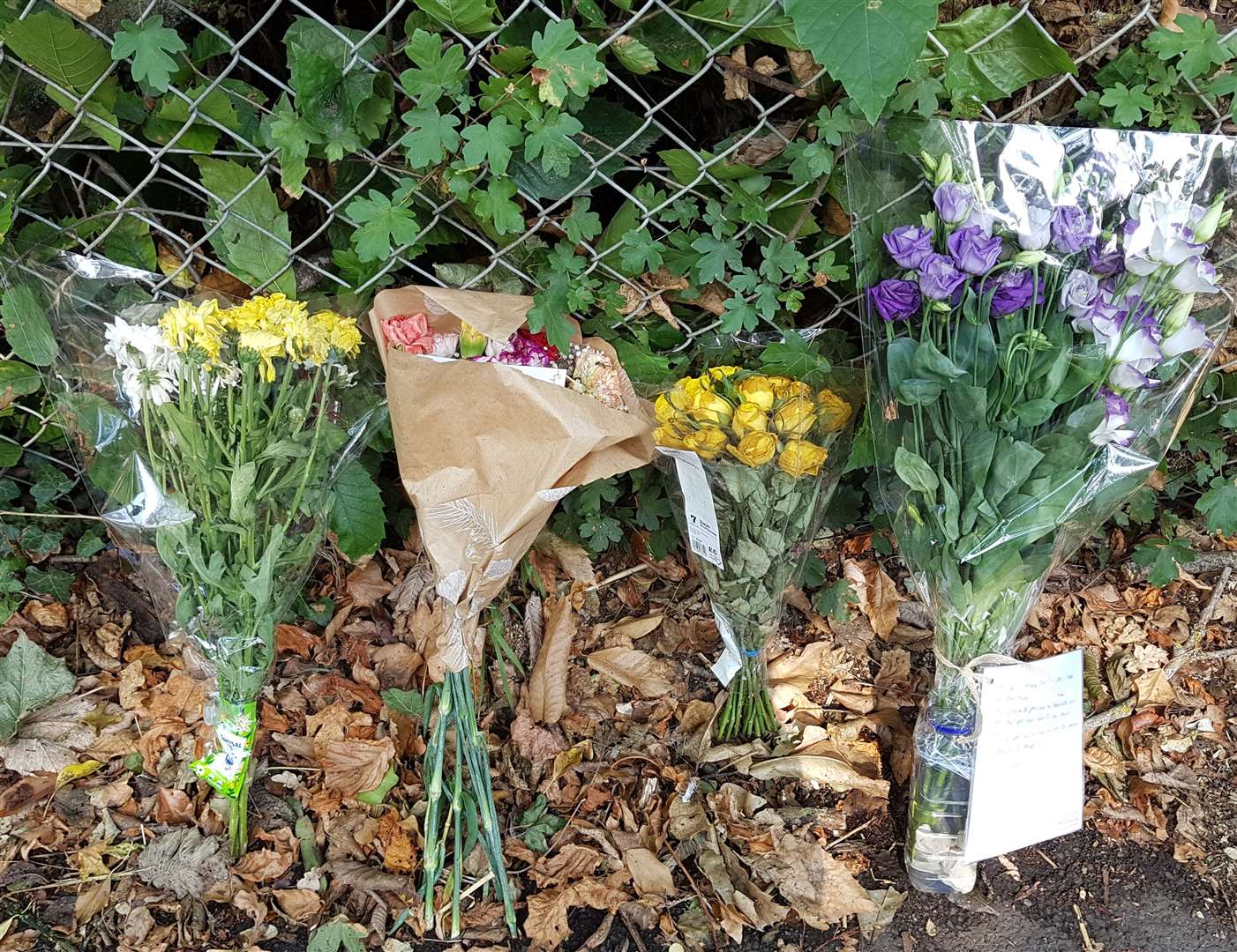 Floral tributes have been left at the spot where the dog walker died on Pembury Road in Tonbridge