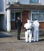 Police officers outside the house in South Street, Canterbury, last year