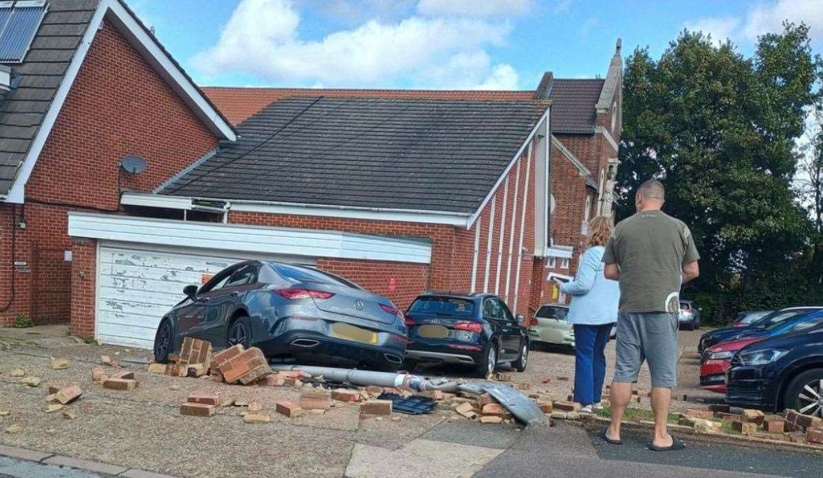 A Mercedes car crashed through a brick wall at St John Fisher Catholic Church in Rochester. Picture: John Haynes