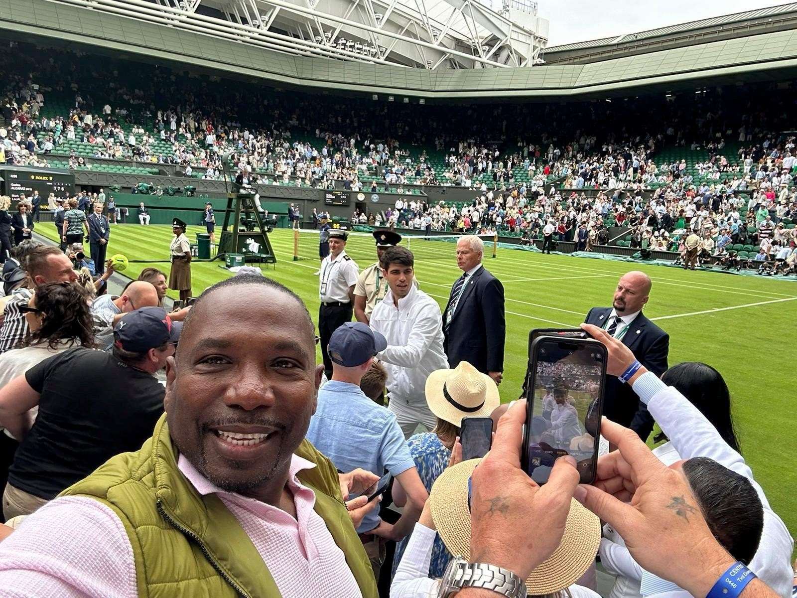 Harry Taylor at Wimbledon watching Carlos Alcaraz. Picture: SWNS