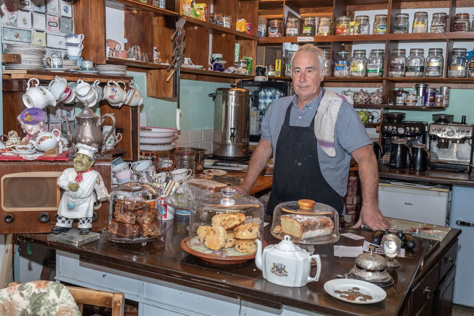 Steve Jackson at the counter of his Jacksonwood tea rooms in Sheerness High Street. Picture: SWNS/Gwyn Wright