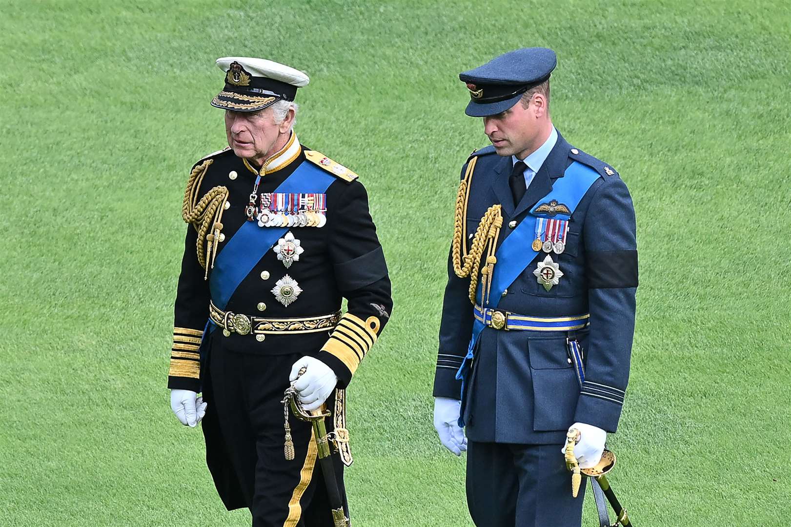 King Charles III and the Prince of Wales join the Ceremonial Procession of the coffin of Queen Elizabeth II (Glyn Kirk/PA)