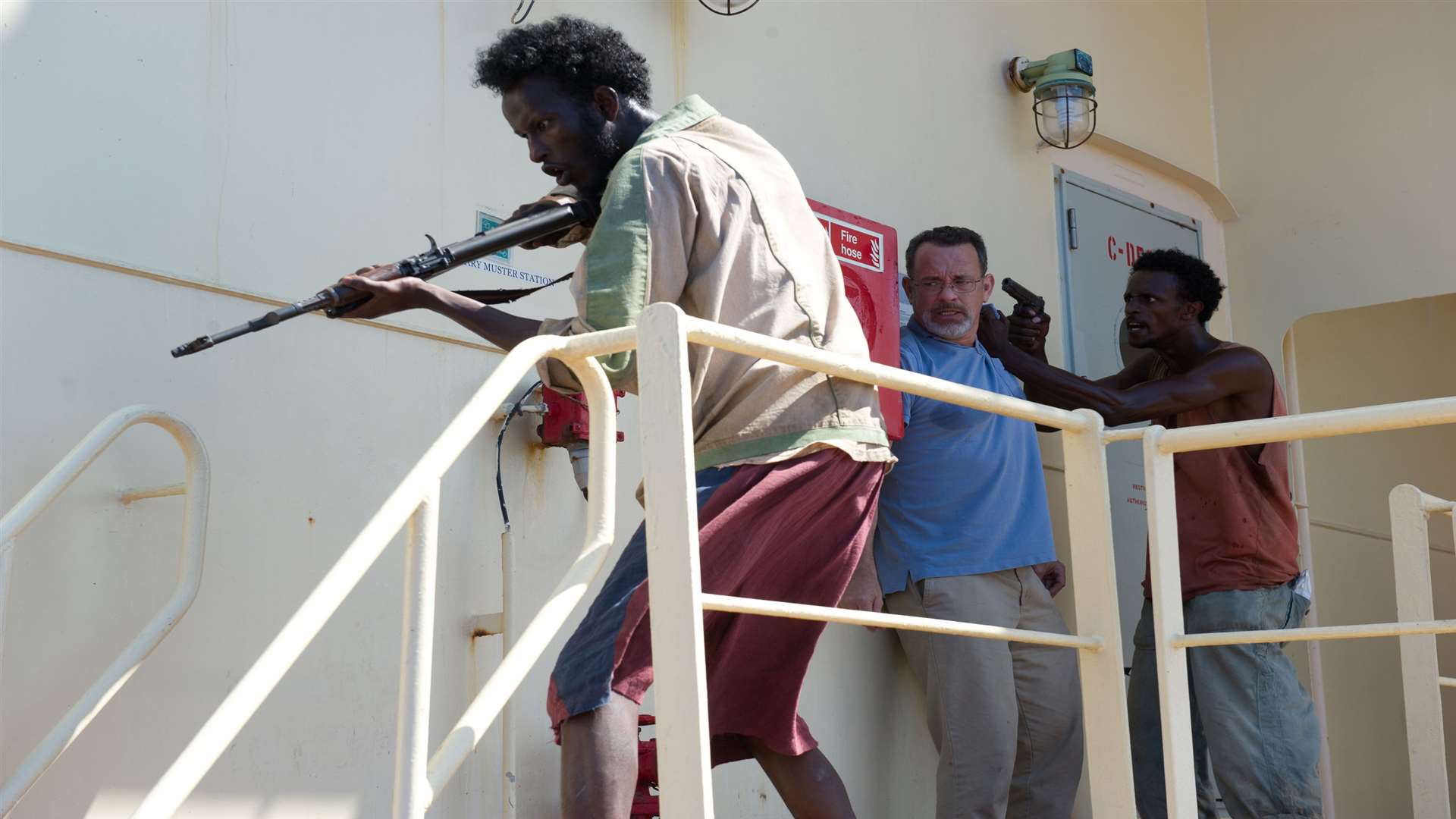 Captain Phillips, with Mahat M Ali as Elmi, Tom Hanks as Captain Richard Phillips and Faysal Ahmed as Najee. Picture: PA Photo/Sony Releasing