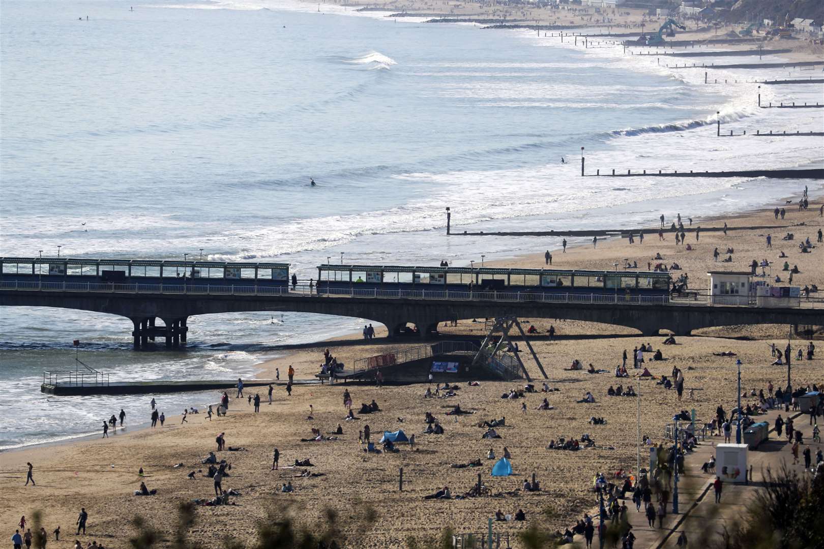 People enjoy the sunshine on Bournemouth beach (Steve Parsons/PA)