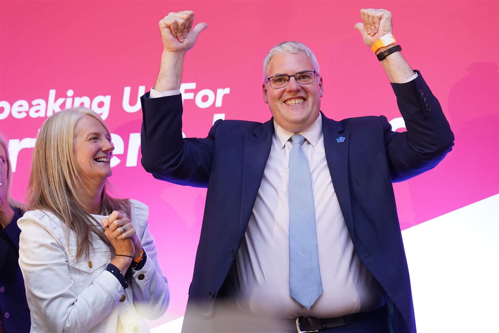 DUP leader Gavin Robinson raises his arms after speaking during the party’s annual conference at Crowne Plaza Hotel in Belfast (Brian Lawless/PA)