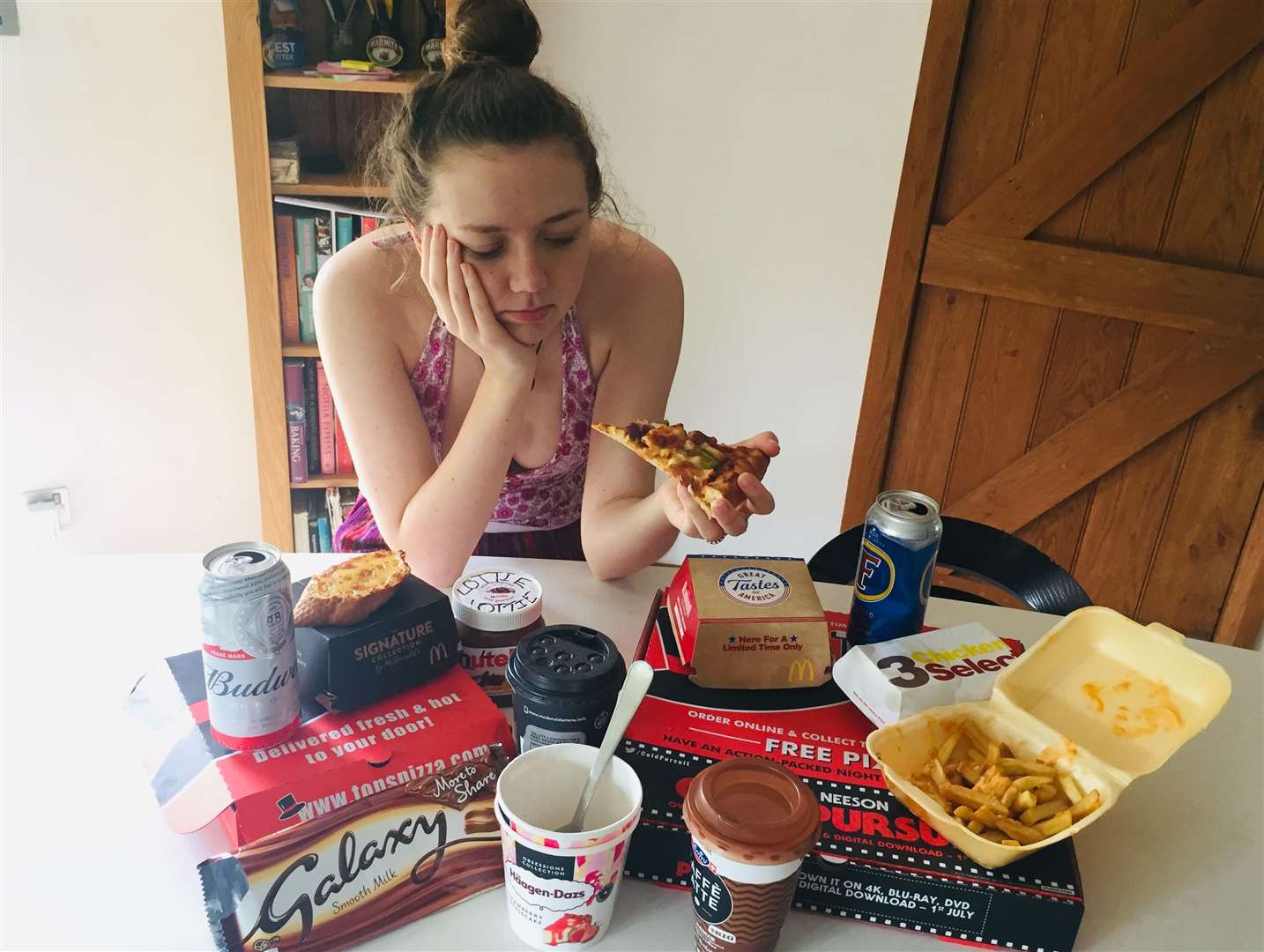 Rebecca surrounded by all the food she is going to try and resist for a week