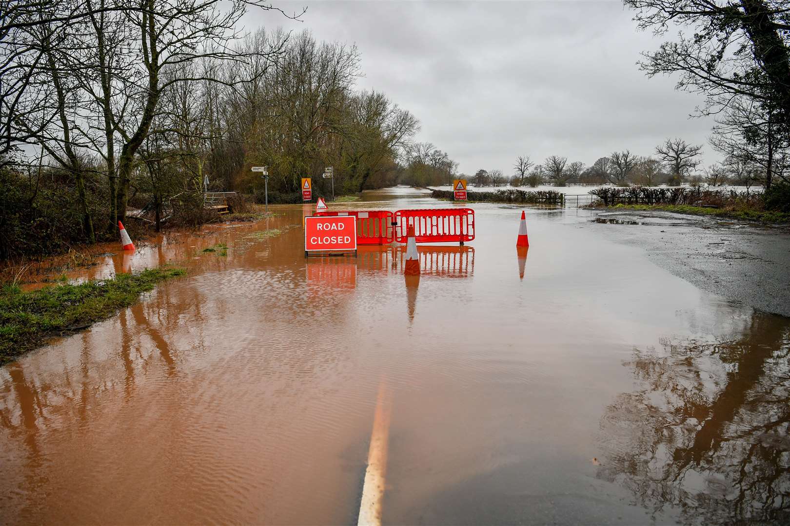 A road is completely flooded and closed off in Lower Applerlay, Gloucestershire (Ben Birchall/PA)