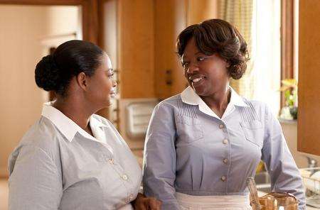 Octavia Spence, left, as Minny Jackson and Viola Davis as Aibileen Clark in The Help. PA Photo/Walt Disney Studios Motion Pictures UK.