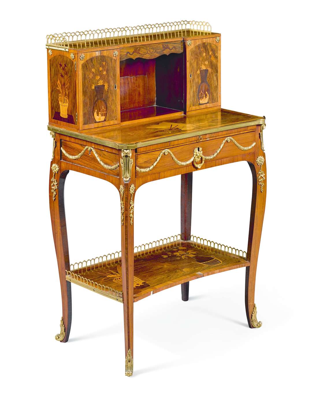 A Louis XVI Marquetry writing desk made of kingwood and rosewood, in the manner of Charles Topino (est. £2,000-3,000)