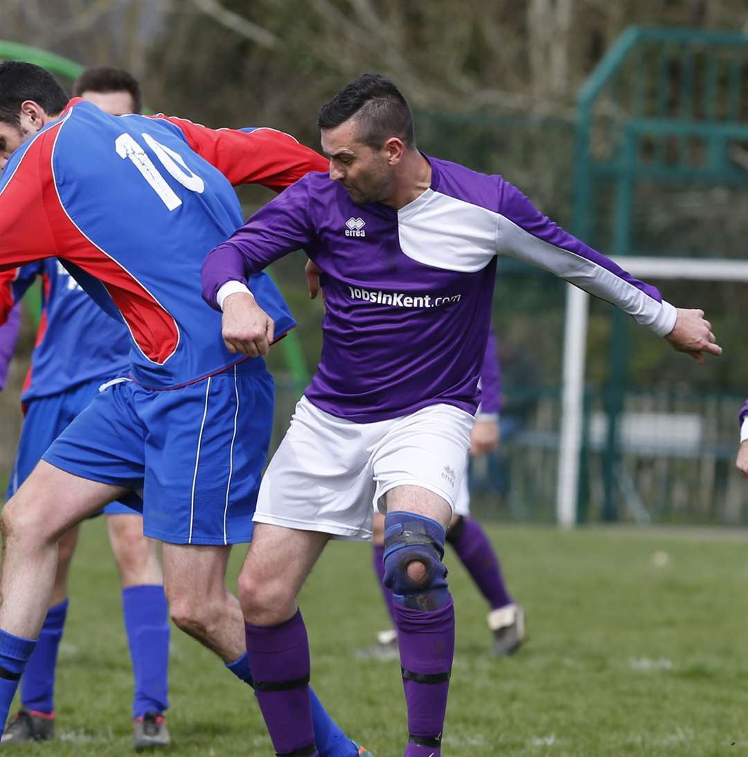 Wayne Duck, pictured in purple, died in hospital after being "punched in the head" in Maidstone town centre