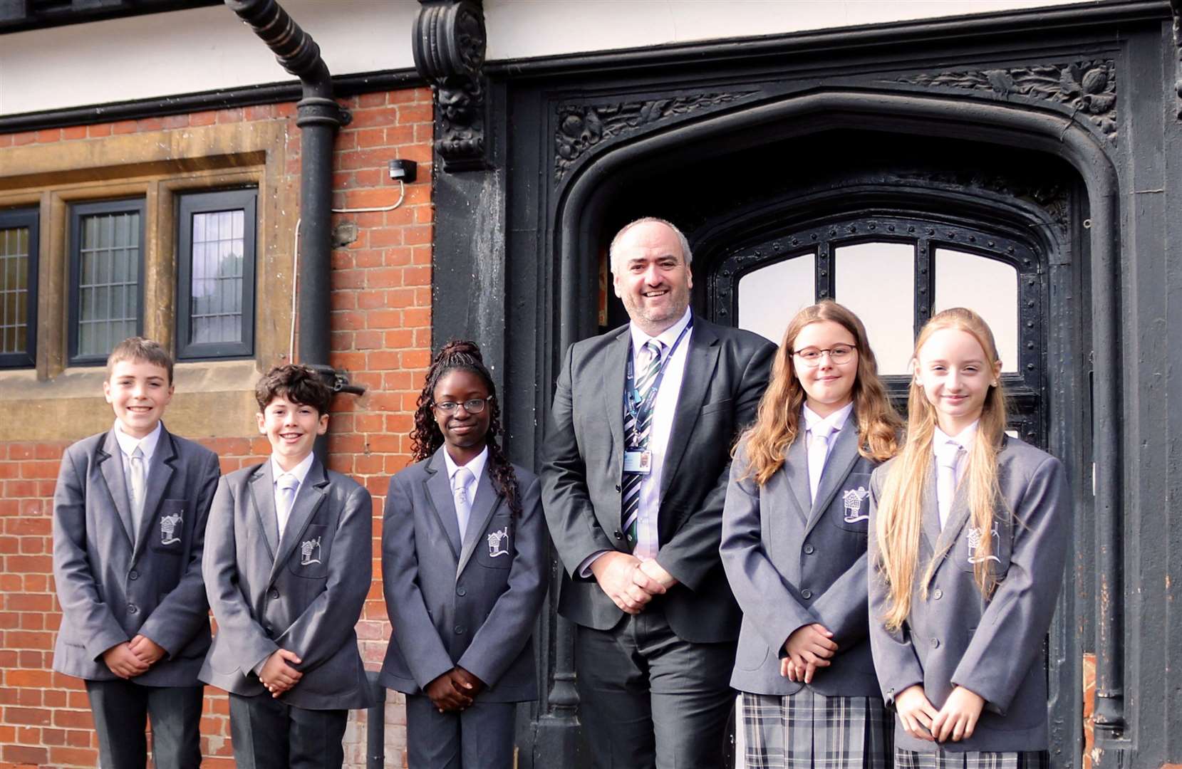 Holcombe Grammar School pupils in their new co-ed uniform with Lee Preston, Headteacher. Credit: Samantha Rees