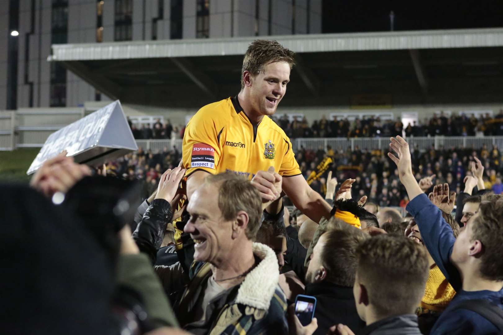 Sonny Miles is held aloft by Maidstone supporters after their FA Cup first-round replay win against Stevenage in 2014 Picture: Martin Apps