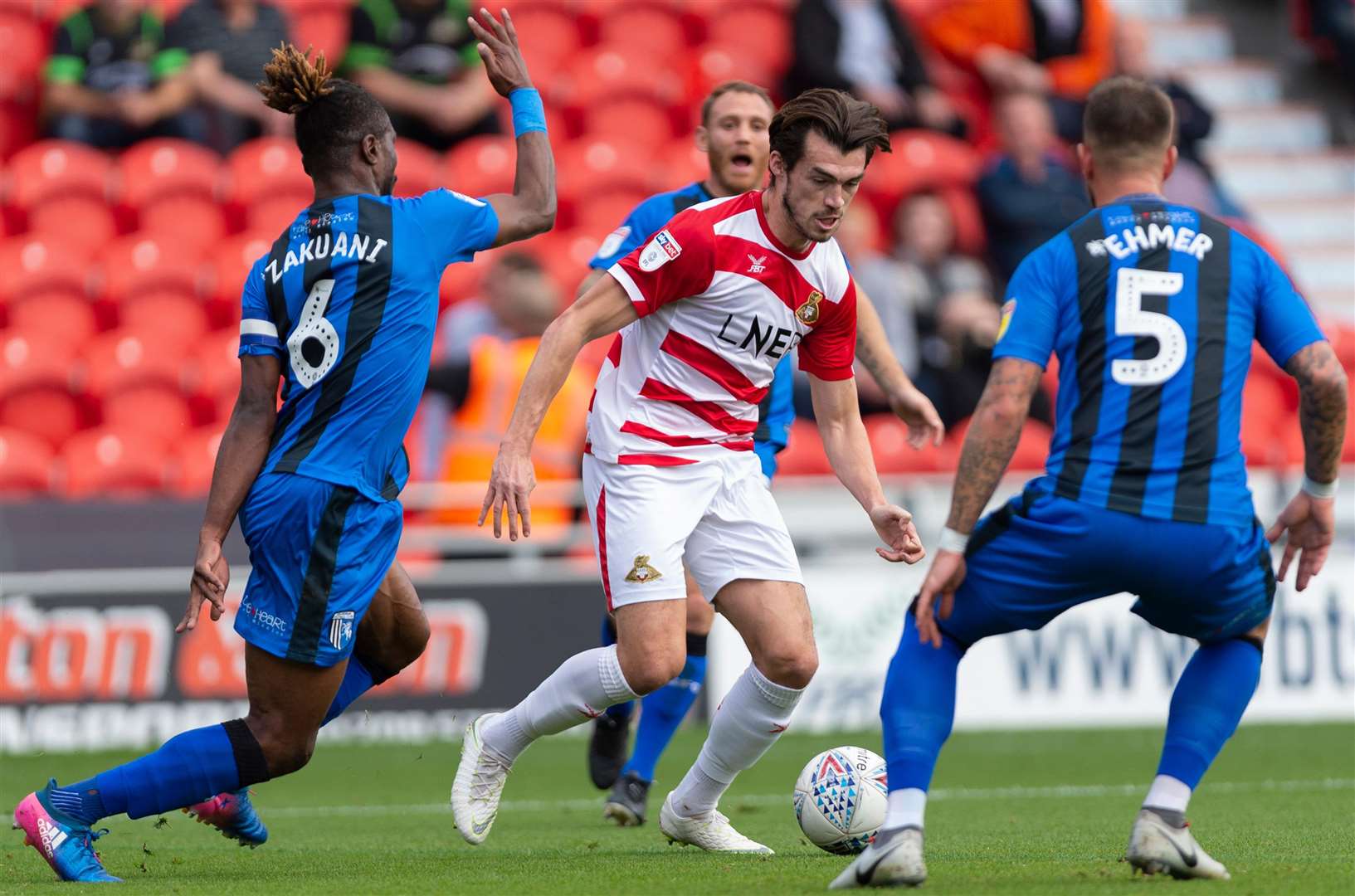 Former Gills forward John Marquis takes on the visiting defence. Picture: Ady Kerry
