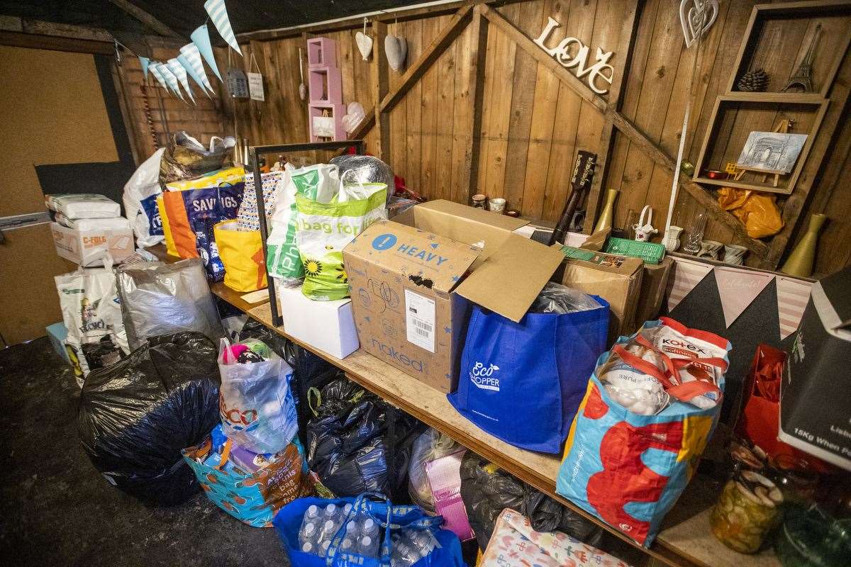 One day’s donations for the Ukrainian people that has been dropped of to Monika Rawson’s restaurant Smokey Deli in east Belfast (Liam McBurney/PA)