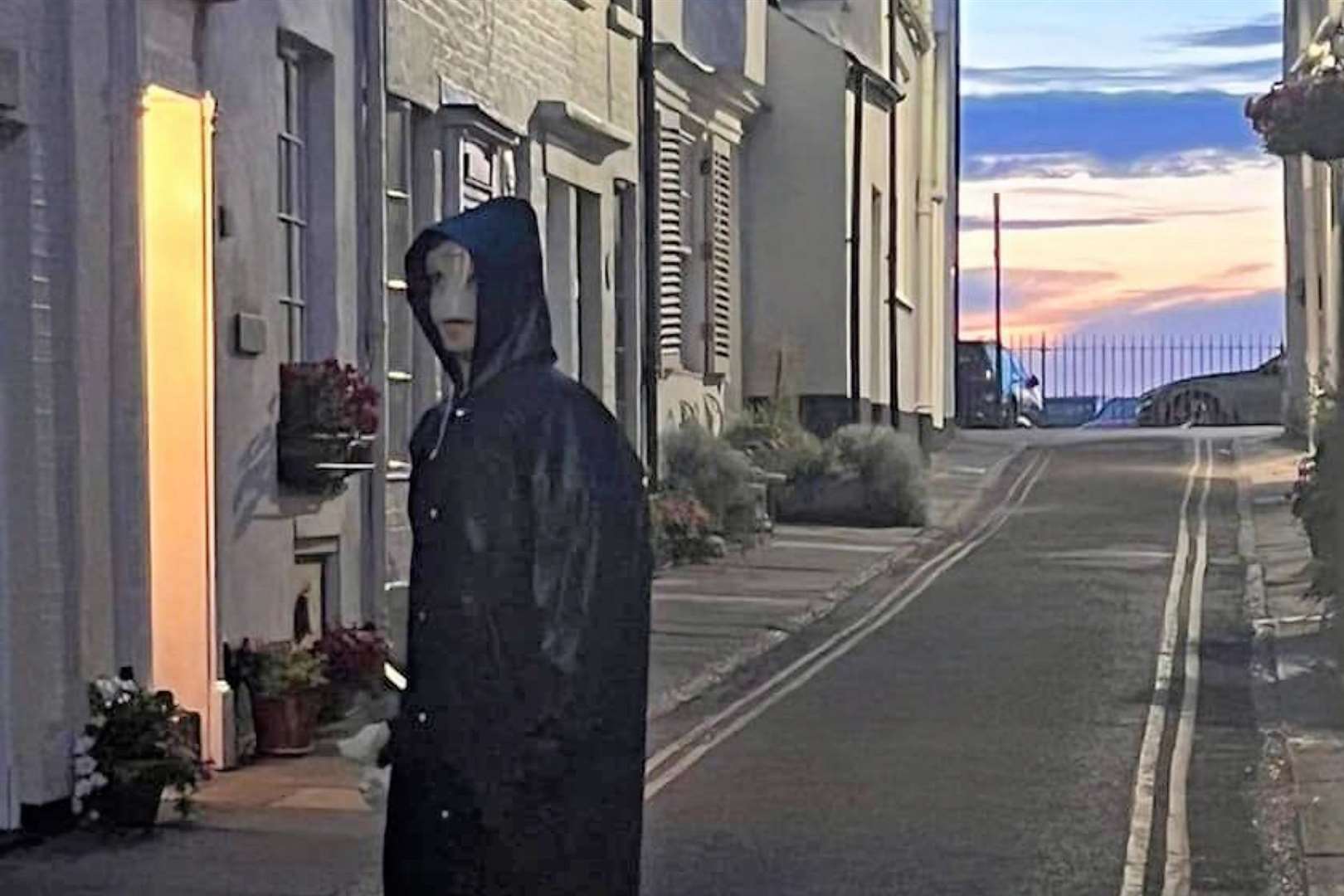 The creepy character in white mask and long black coat seen in Deal