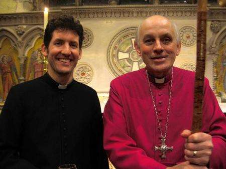 The Reverend James Pettit, new team vicar of St Mary and St Michael, Sittingbourne, celebrating his appointment with the Bishop of Dover, the Right Reverend Trevor Willmott, after his licensing.