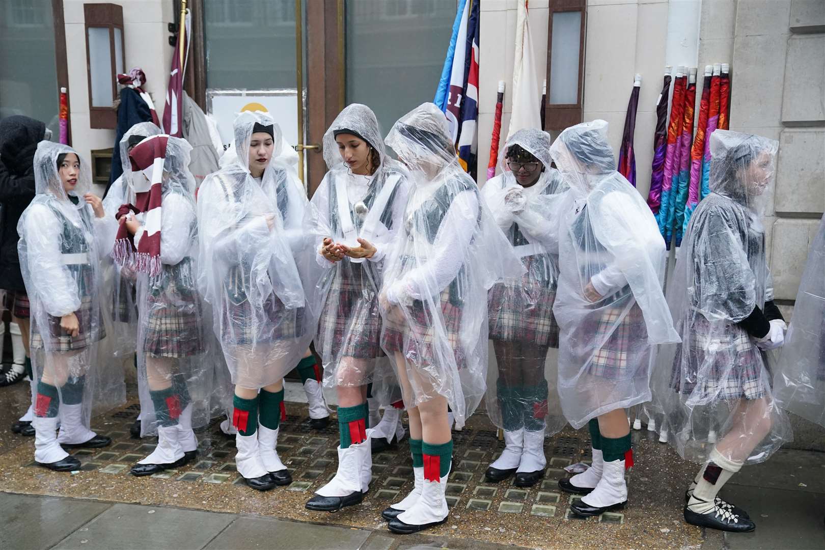 Rain falls as marching band members from Riverview High School in Florida prepare to take part in the New Year’s Day Parade in central London (Jonathan Brady/PA)