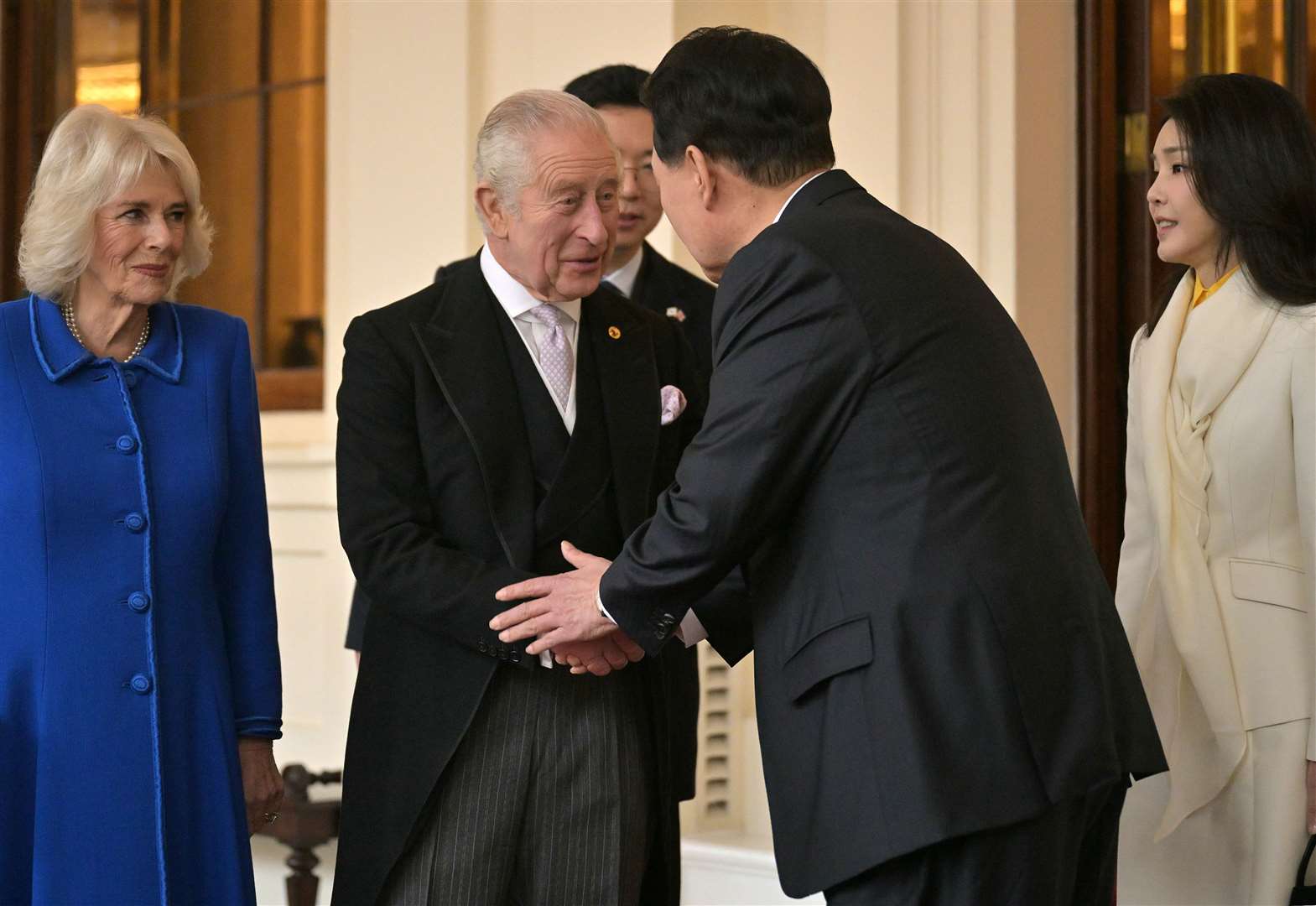 South Korea’s President Yoon Suk Yeol shakes hands with the King (Ben Stansall/PA)