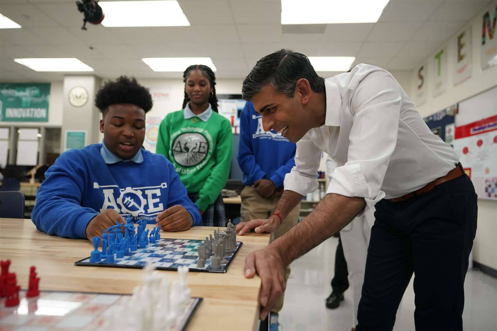 Prime Minister Rishi Sunak is shown a 3D-printed chess set during a visit to the Friendship Technology Preparatory High School in Washington DC (Niall Carson/PA)