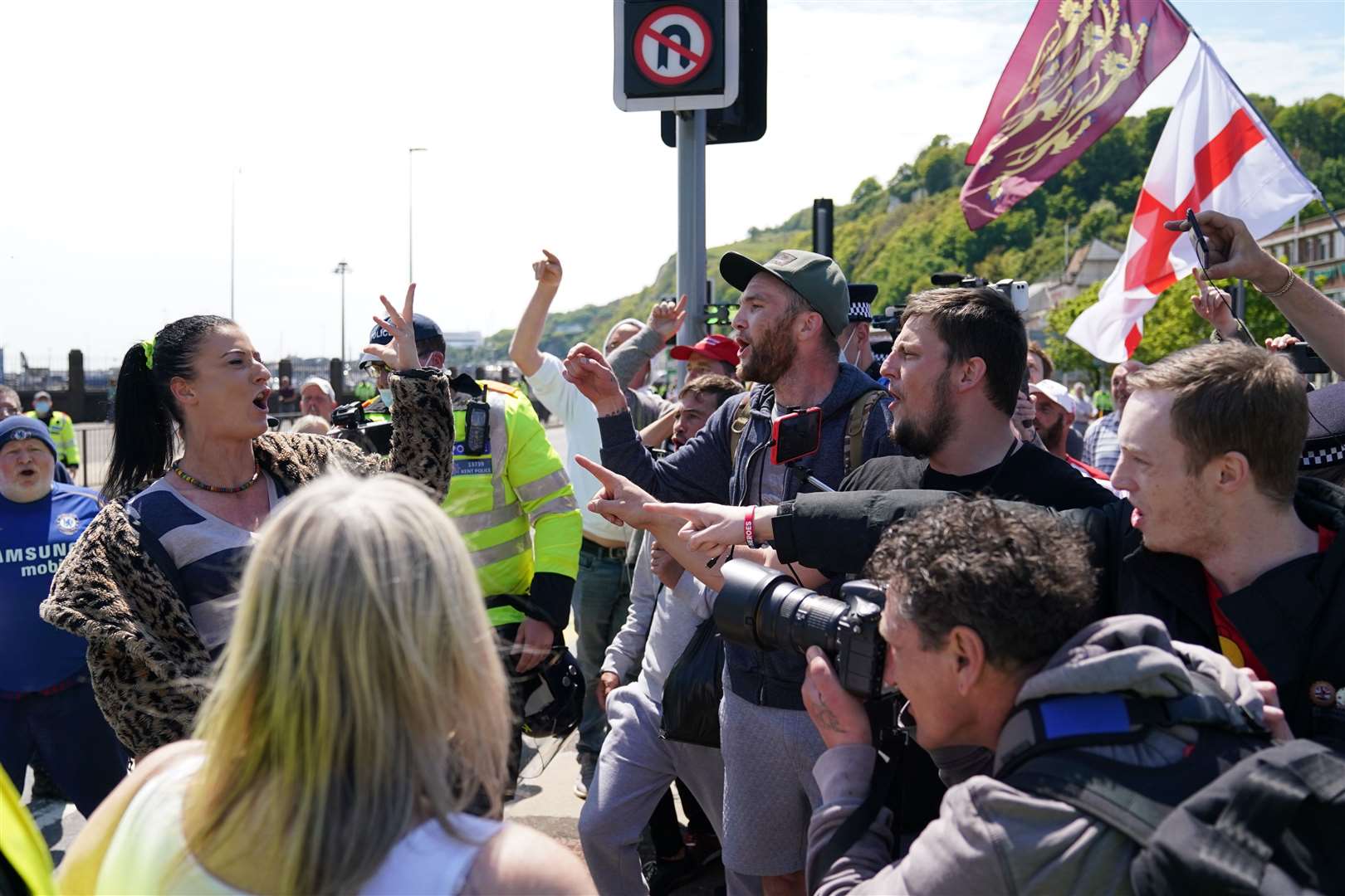 A woman airs her views as she counter protests against anti-migrant protesters demonstrating in Dover against immigration and the journeys made by refugees crossing the Channel to Kent (PA)