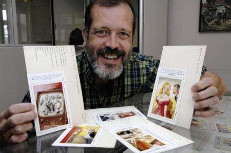 Dr Nick Hiley, head of the British Cartoons Archive at the University of Kent, with one of the Bamforth postcards