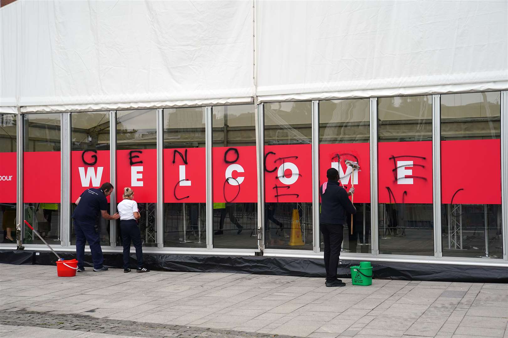 Protesters attempted to graffiti ‘genocide conference’ on the outside of the conference centre (Peter Byrne/PA)