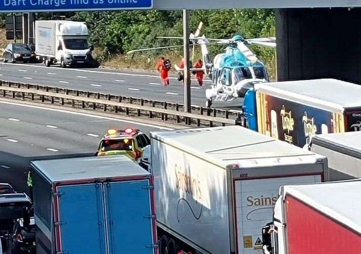 Air ambulance crews were spotted arriving as traffic is held. Picture: Phillip Marvell