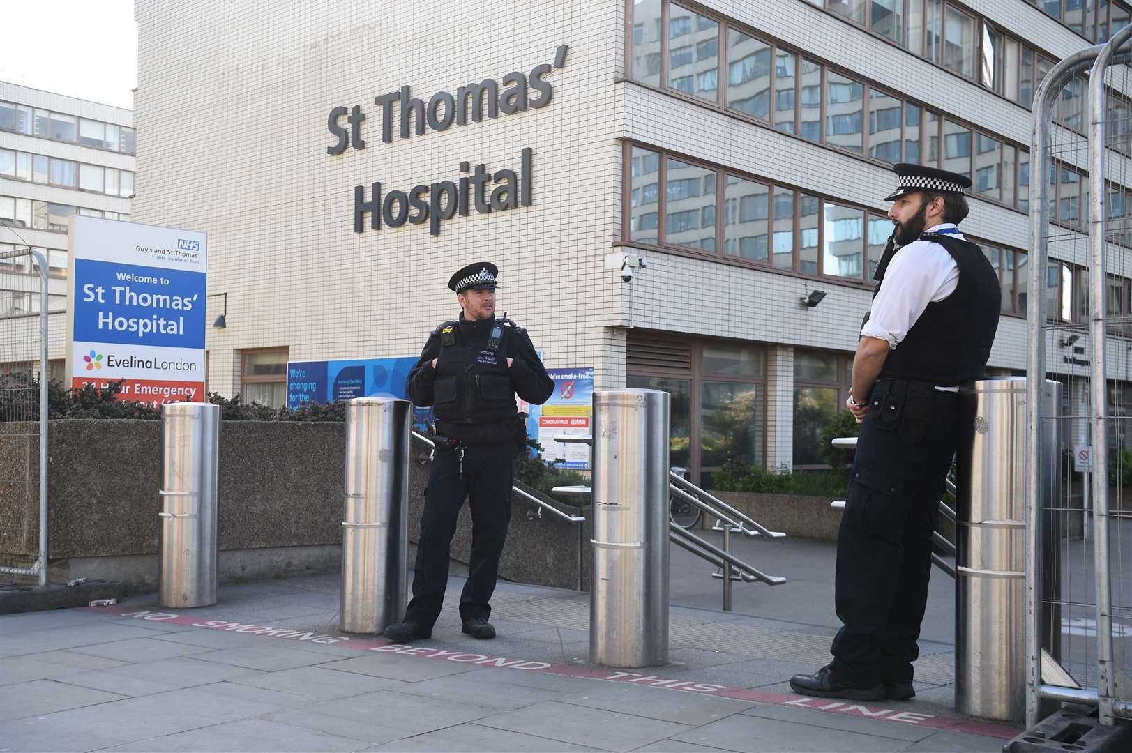 Police officers outside St Thomas’ Hospital where Boris Johnson is in intensive care (Kirsty O’Connor/PA)