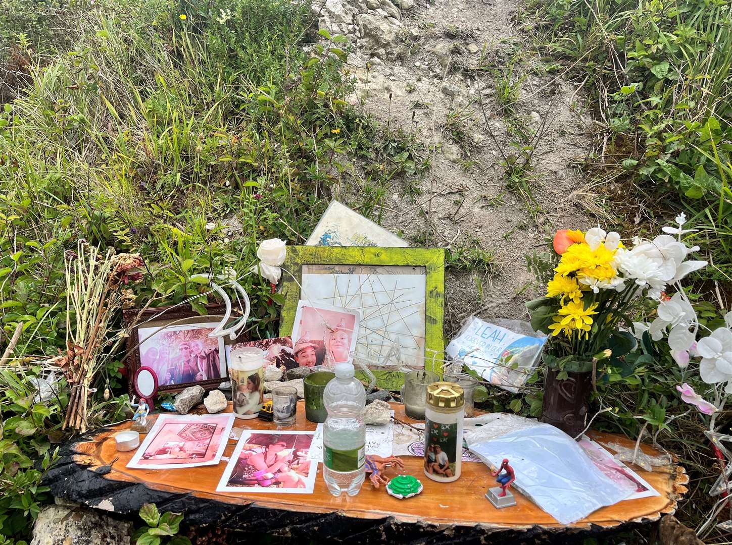 Tributes left at the area where Leah Daley was found at The Warren in Folkestone