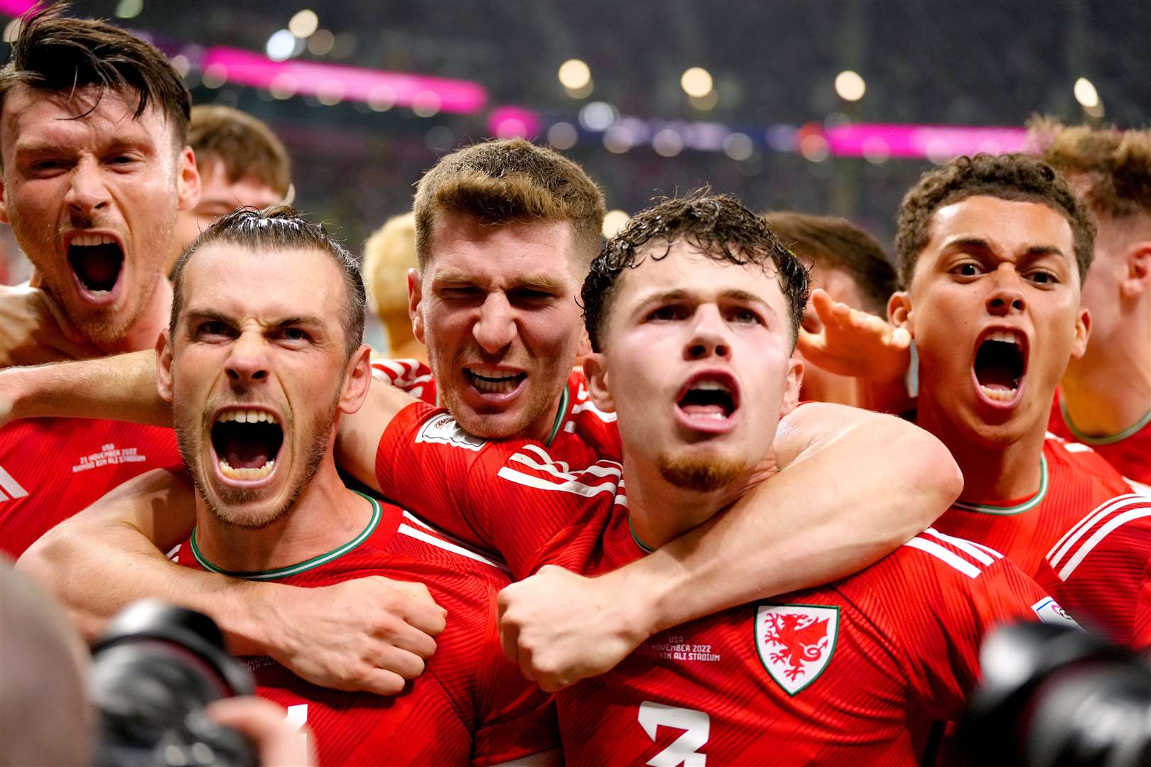 Wales’ Gareth Bale (second left) celebrates with his team-mates after scoring their side’s first goal of the game from the penalty spot during the FIFA World Cup Group B match (Nick Potts/PA)