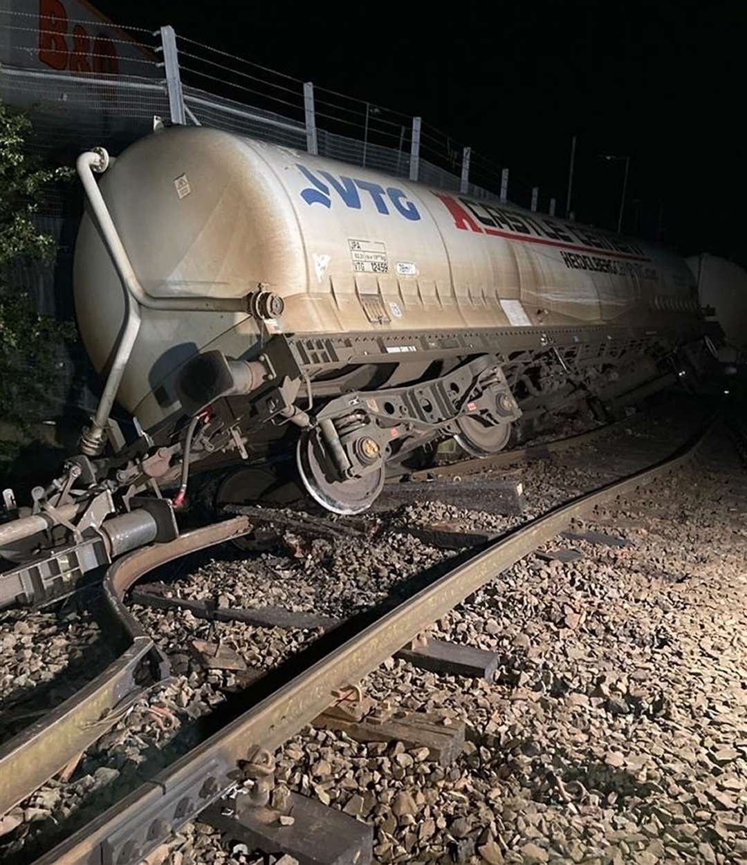 The freight train carrying cement after it came off the tracks over the River Petteril near Carlisle shortly after 8pm on Wednesday(Network Rail/PA)