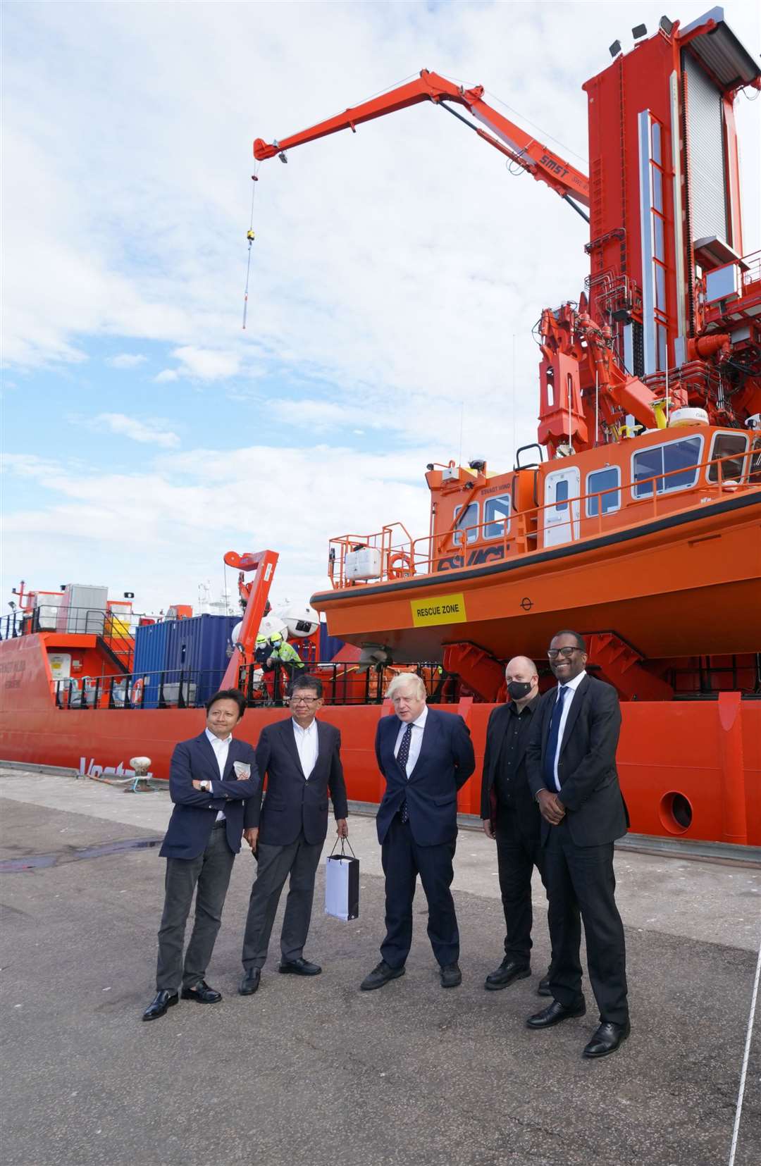 Prime Minister Boris Johnson (centre) and business minister Kwasi Kwarteng (right), meeting wind farm project investors and project delegates in Fraserburgh Harbour, Aberdeenshire (Jane Barlow/PA)