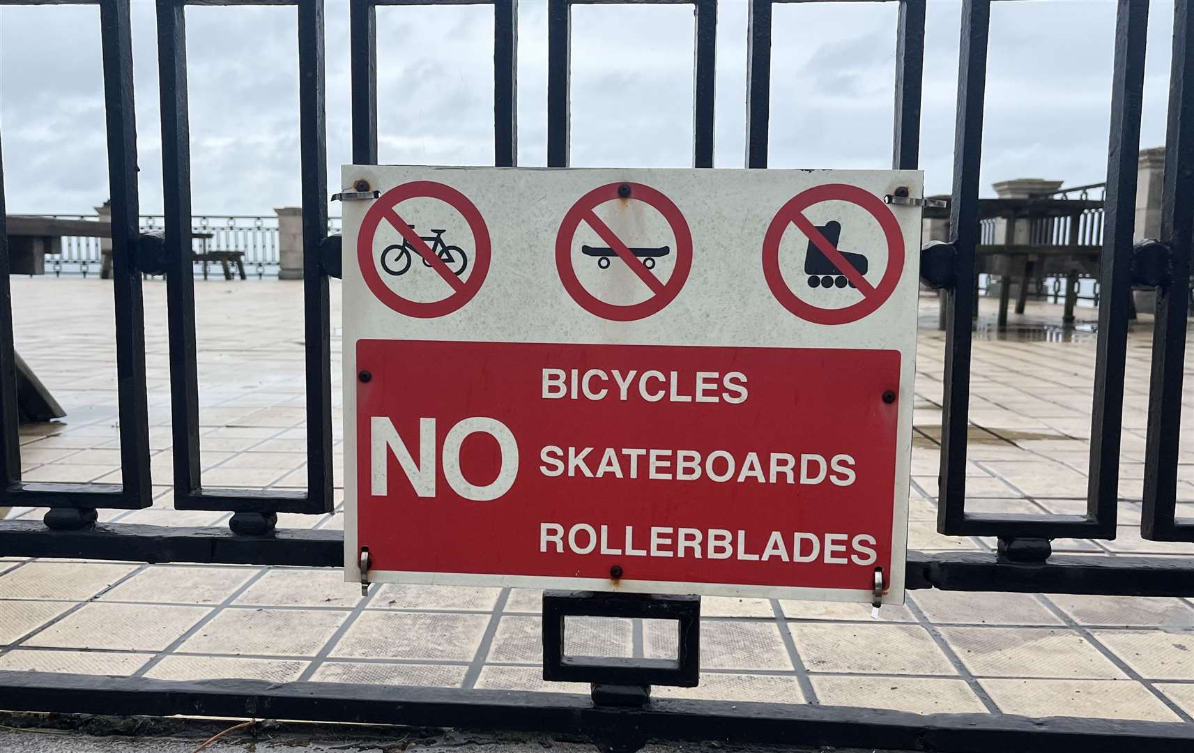 Signs outside The Leas Cliff Hall, Folkestone, say bikes, skateboards and rollerblades are banned