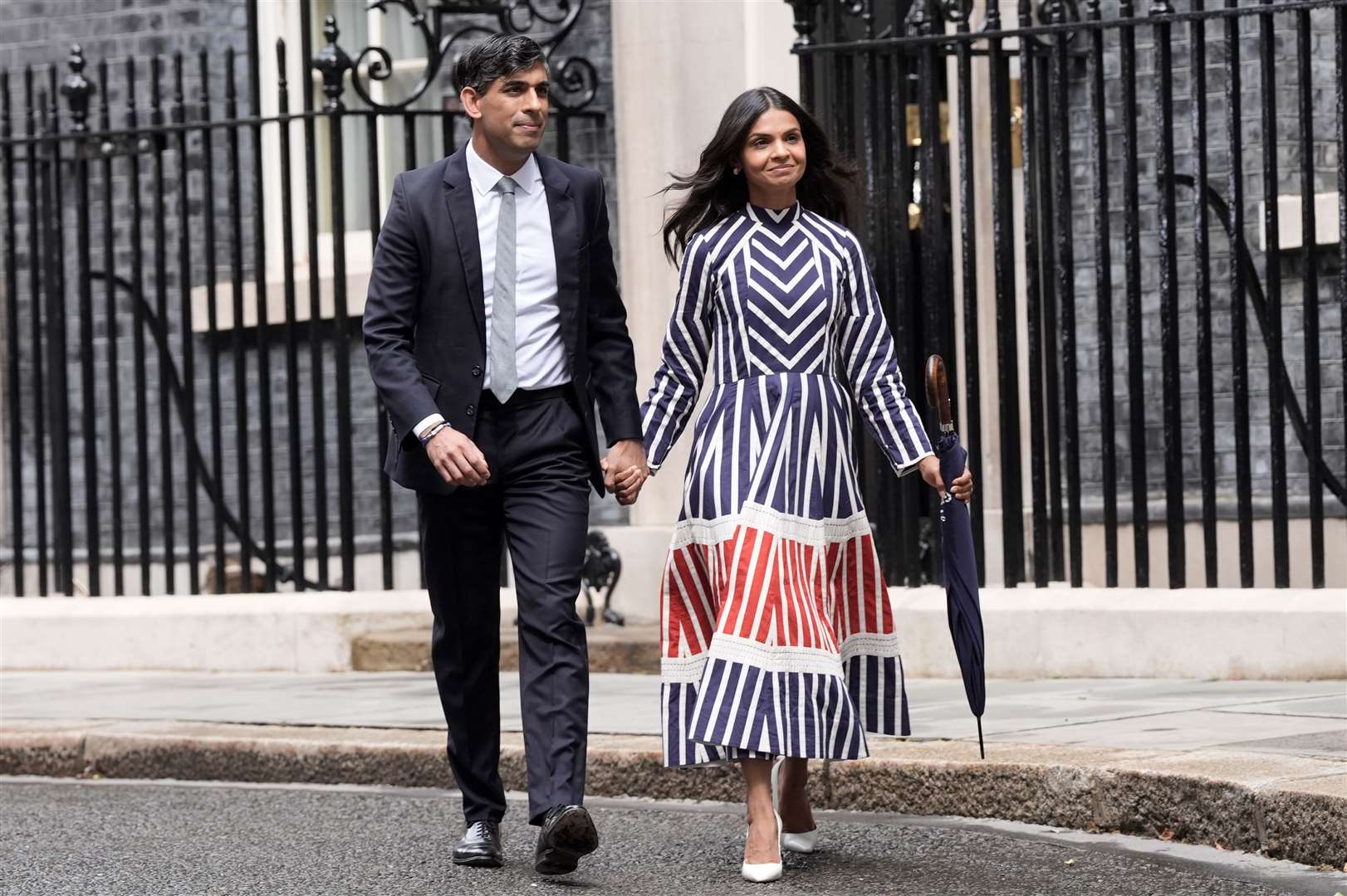 Rishi Sunak leaves Downing Street with his wife, Akshata Murty (Stefan Rousseau/PA)