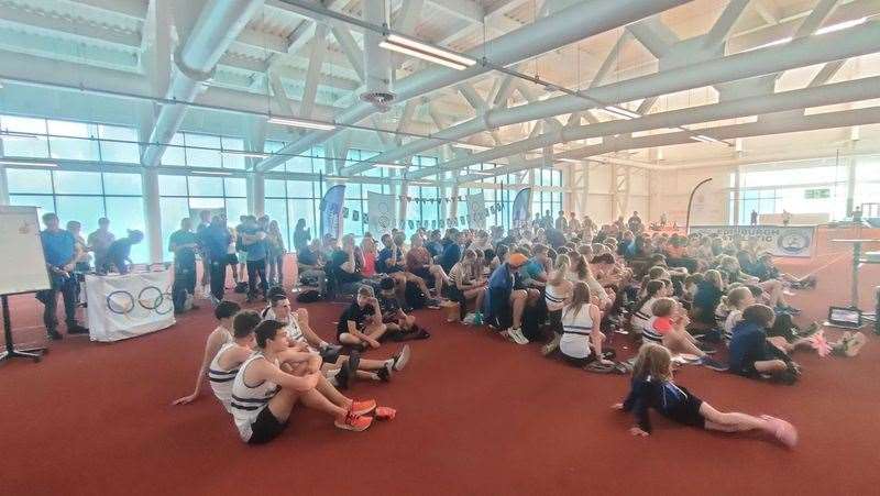 Josh Kerr’s fans, friends, coaches and fellow athletes gather round to watch the track-star’s race (Ryan McDougall/PA)