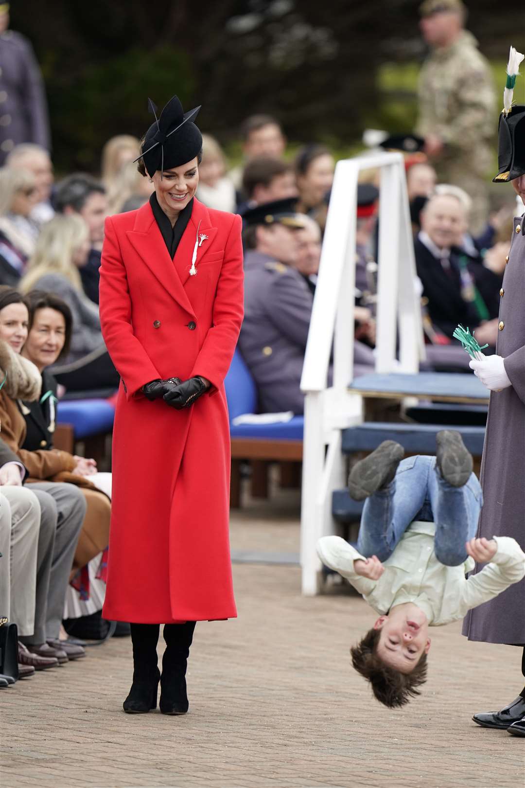 Kate watches a young boy perform a back-flip at the St David’s Day parade (Andrew Matthews/PA)