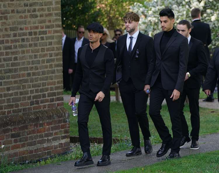The members of The Wanted, from left, Max George, Jay McGuiness, Siva Kaneswaran and Nathan Sykes (partially hidden) arrive for the funeral. Picture: Kirsty O’Connor/PA