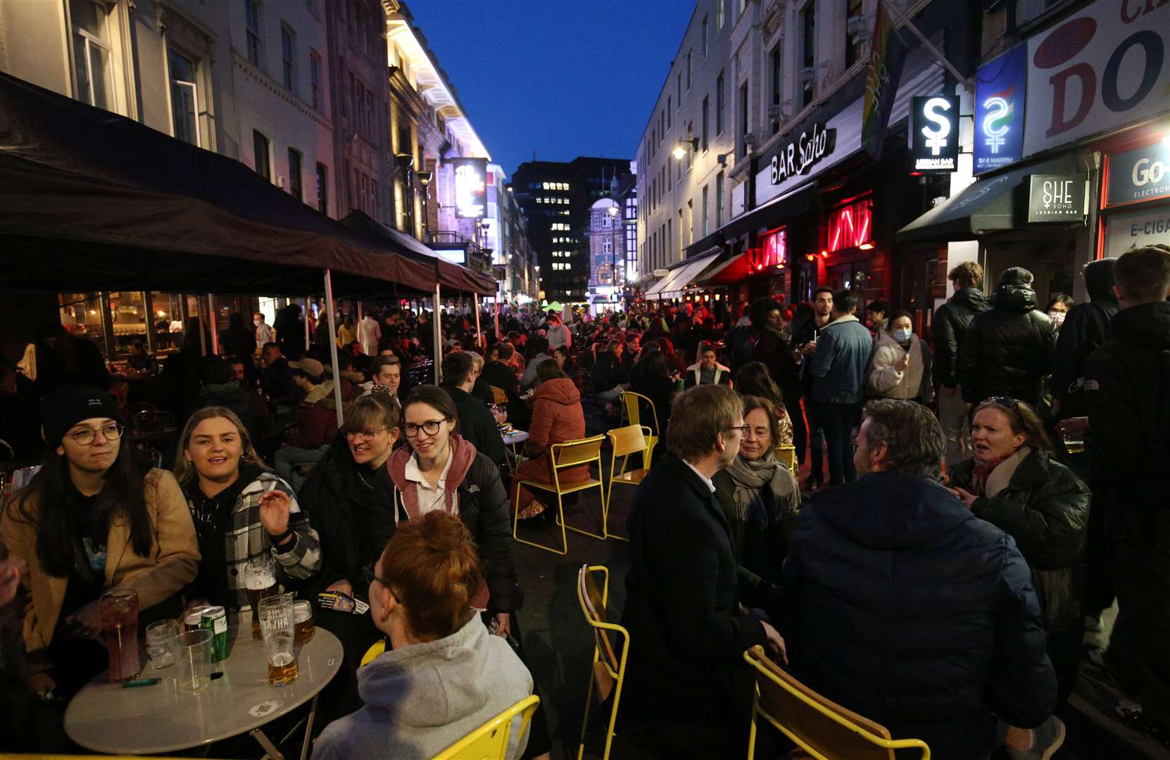 People gather for drinks and food in Soho, central London, after lockdown restrictions were eased in England (Jonathan Brady/PA)