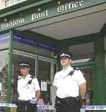 CRIME SCENE: police officers outside the post office in Hadlow. Picture: GRANT FALVEY