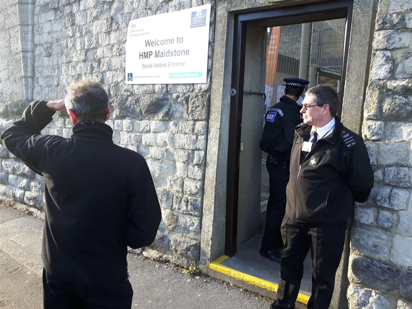 Police and prison officers outside the prison