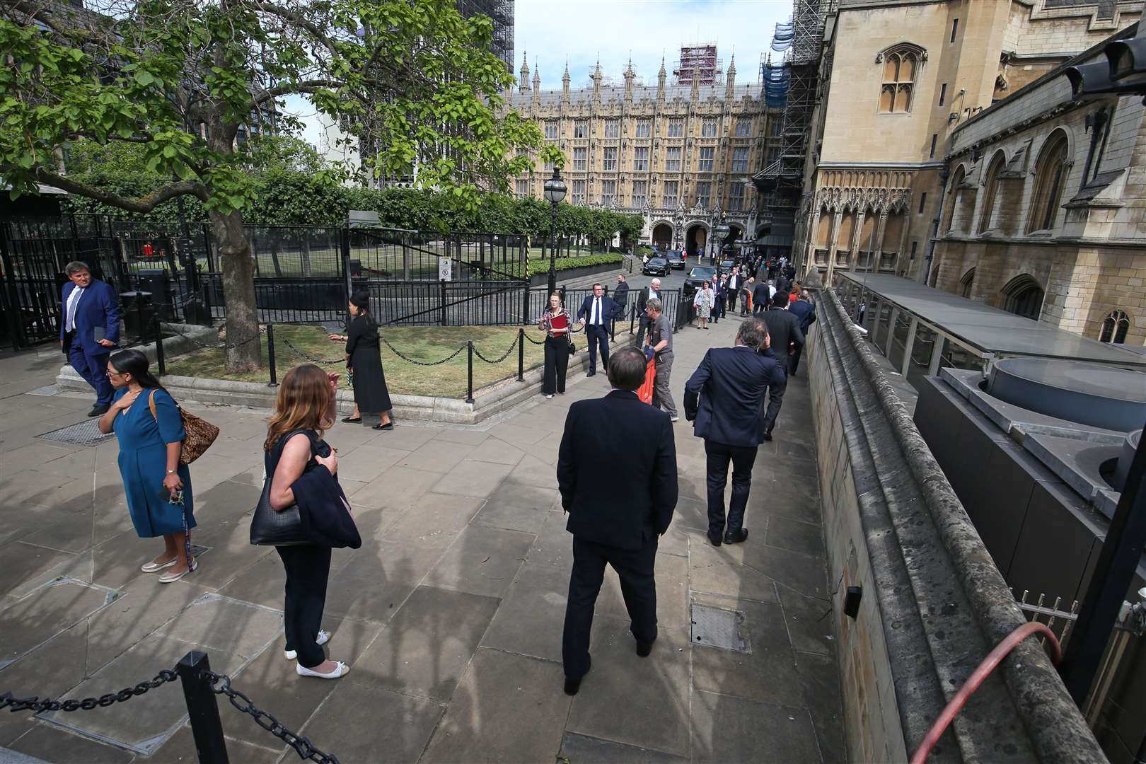 Members of Parliament queue outside the House of Commons (Jonathan Brady/PA)