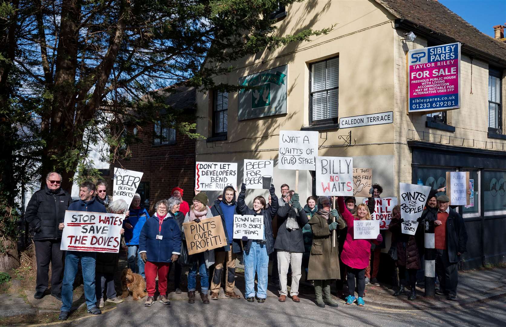 Demonstrators gathered outside the Two Doves in April 2022 in a bid to show support for it being brought back as a boozer. Picture: Nathan Eaton-Baudains