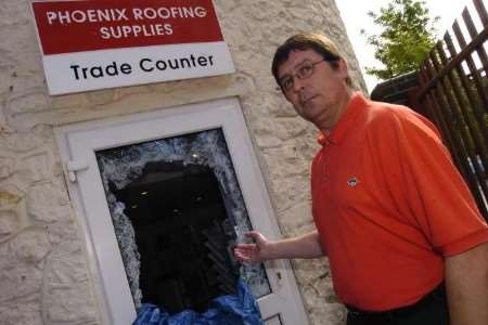 Sales manager Peter McDermott at the spot where the raiders entered the premises. Picture: NICK JOHNSON