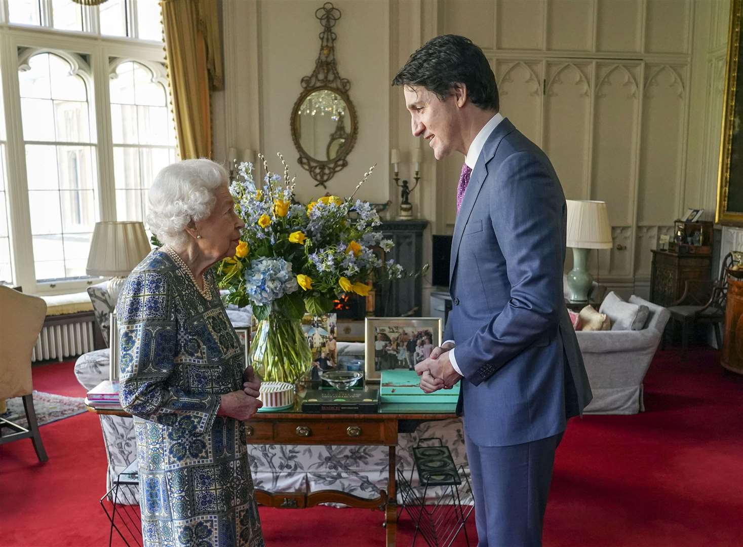 A bouquet of blue and yellow flowers were pictured behind the Queen and Canadian Prime Minister Justin Trudeau at Windsor Castle (Steve Parsons/PA)